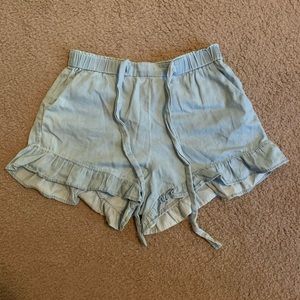 Light blue ruffle shorts with tie waist